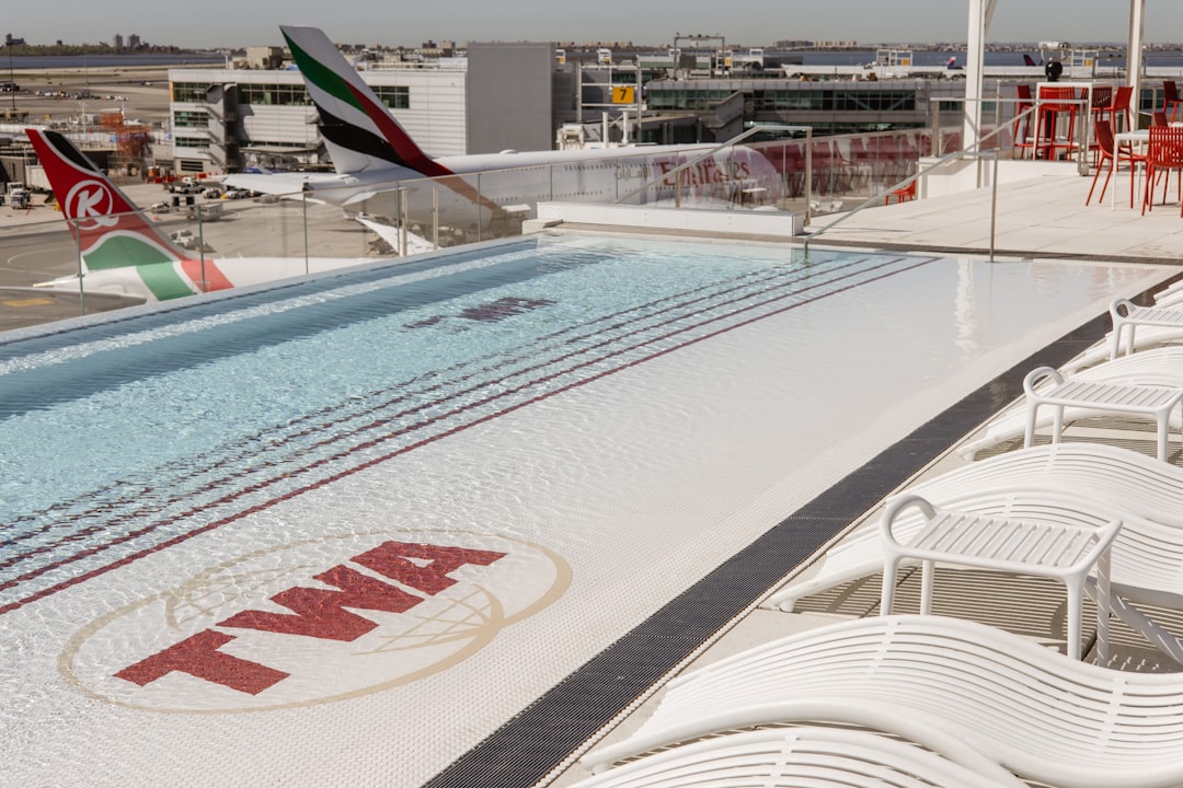 a large swimming pool on top of a building,