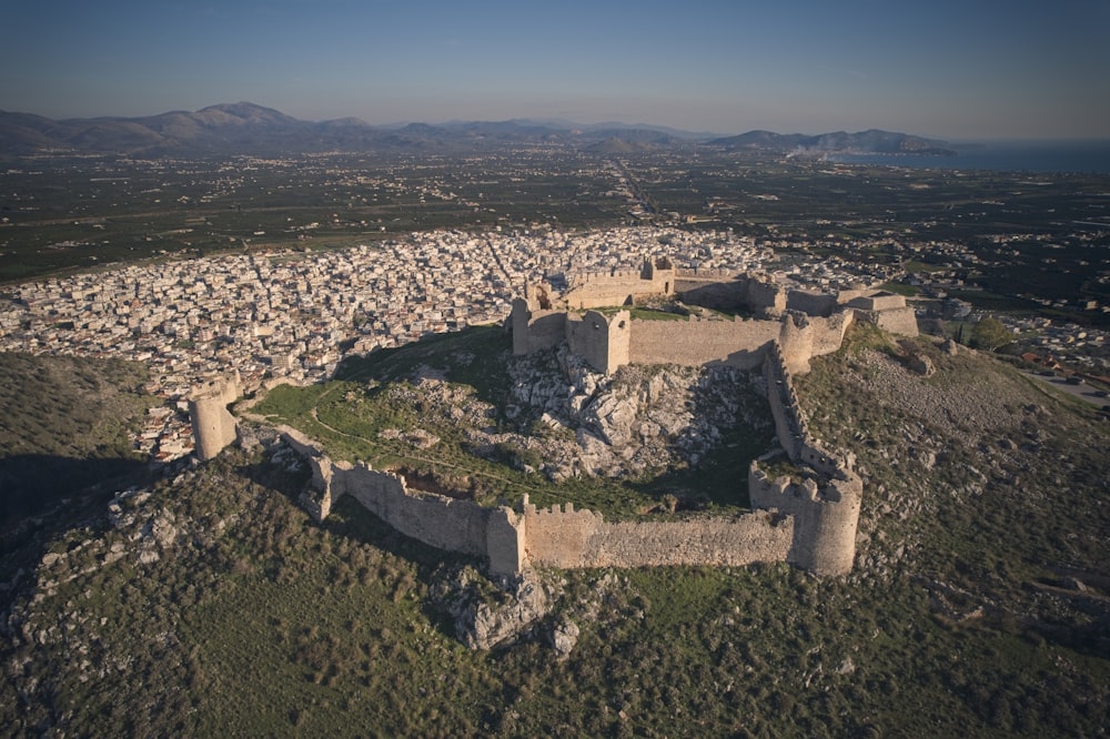 an aerial view of a castle on a hill