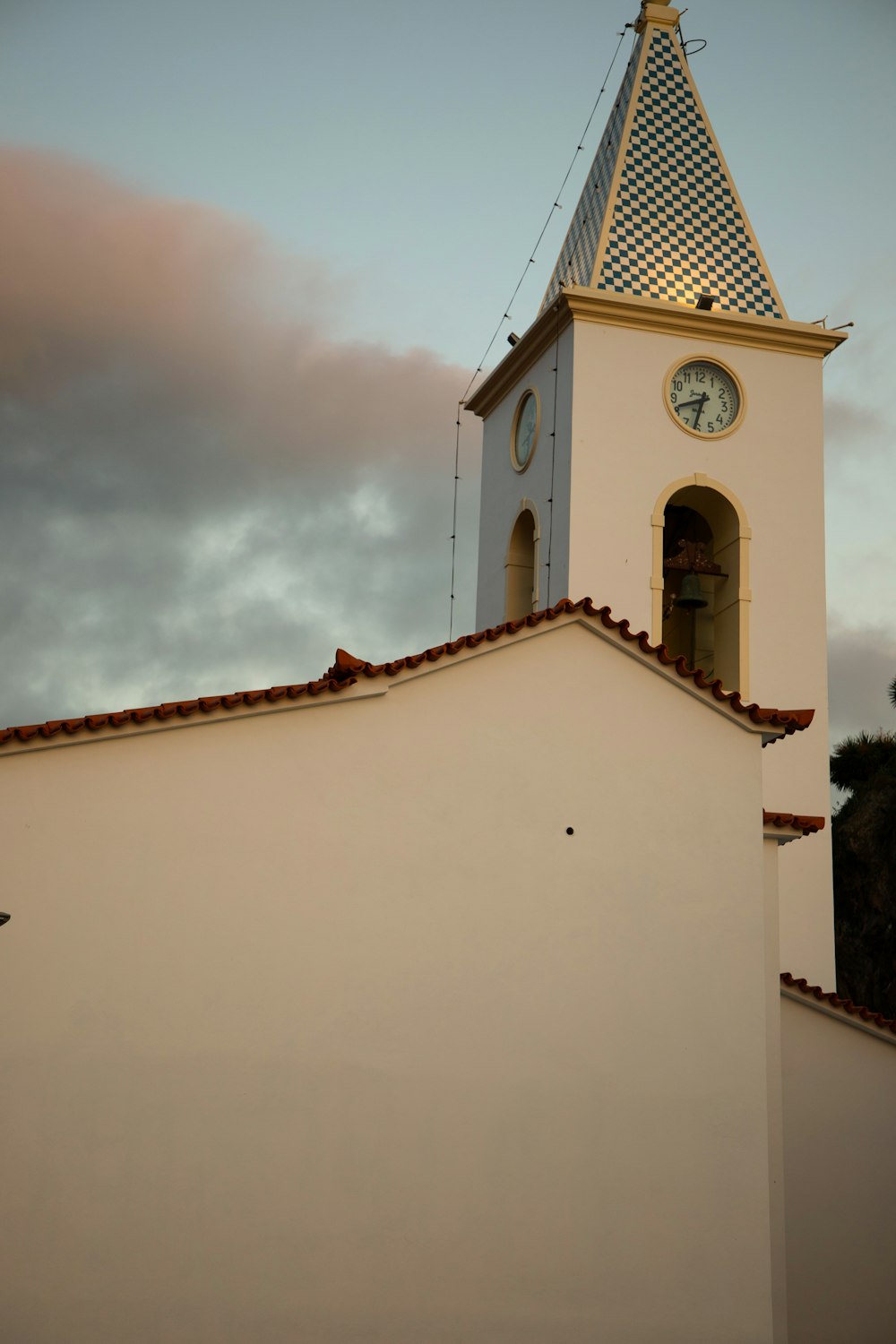 a church steeple with a clock on it