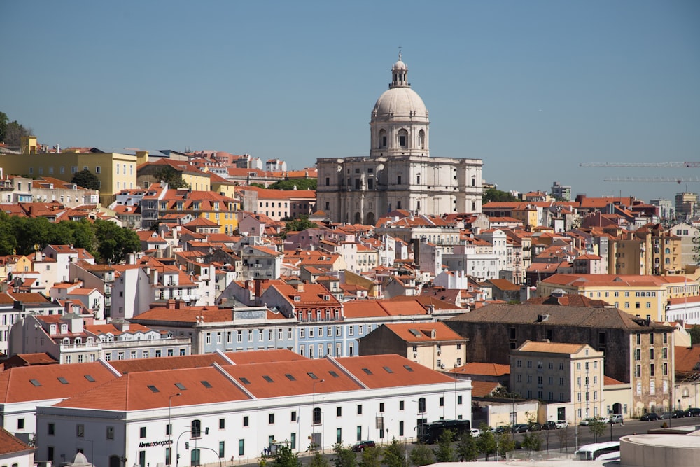 a view of a city with a church in the background