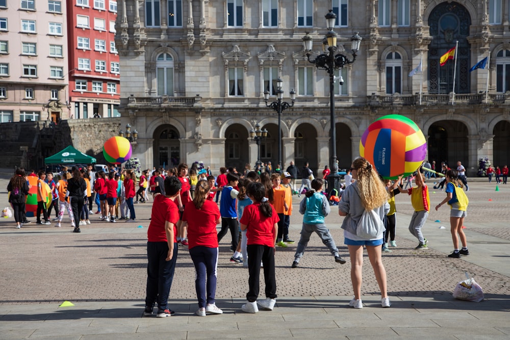 a group of people standing around a building