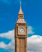 a clock tower with a blue sky in the background