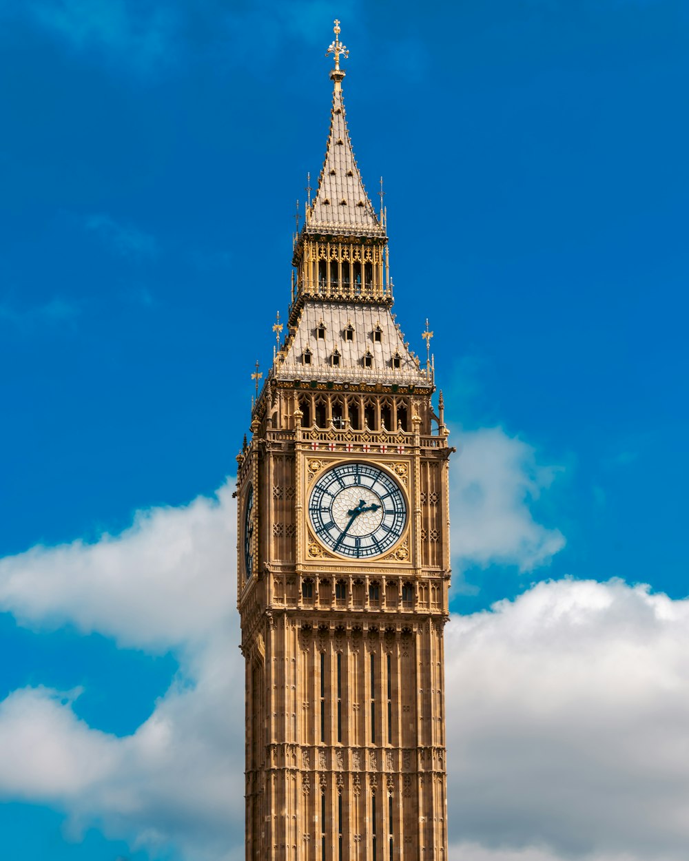 a clock tower with a blue sky in the background