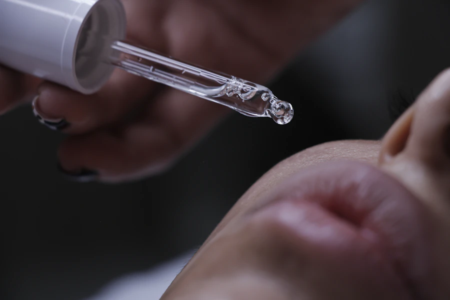 a close up of a person getting a botilage treatment
