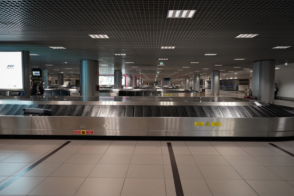 an empty baggage claim area at an airport