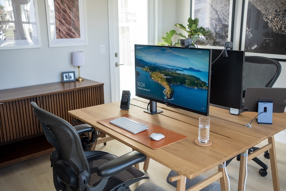 a desk with a monitor and keyboard on it