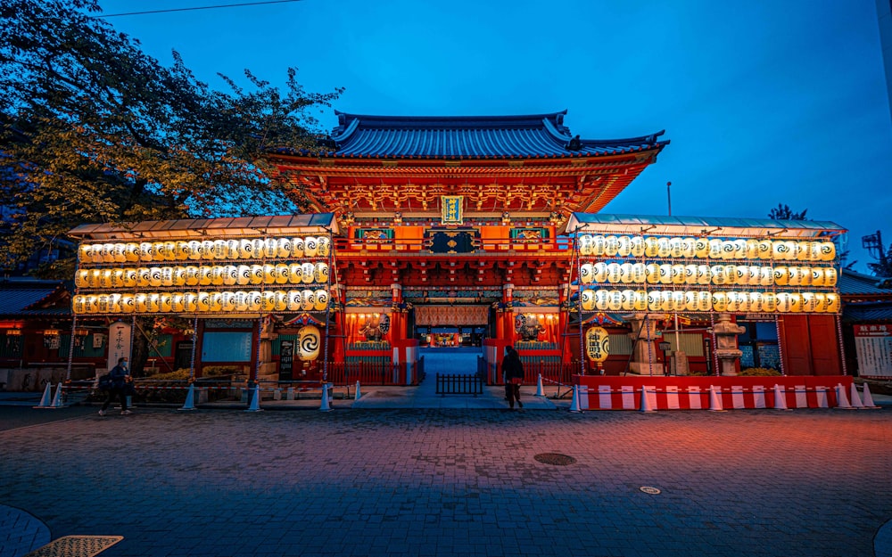 a red and white building with lights on it