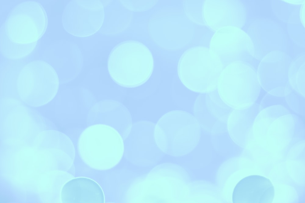 a blurry photo of a blue background with circles