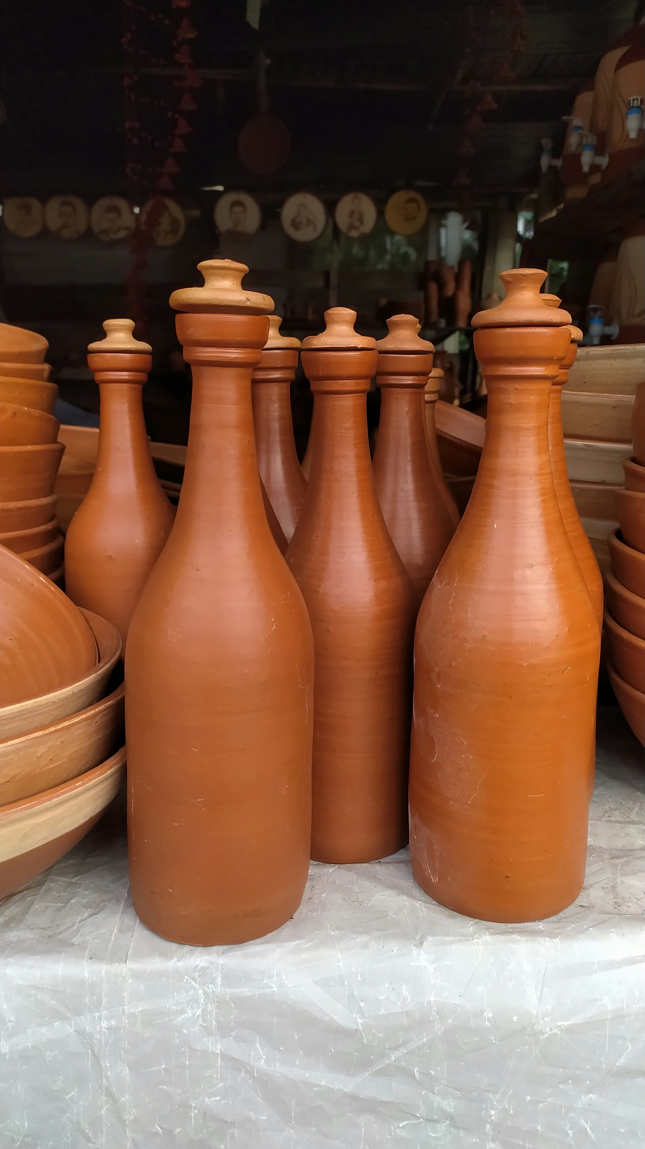 A group of brown vases sitting on top of a table photo – Free Art Image ...