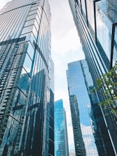 a couple of tall buildings sitting next to each other