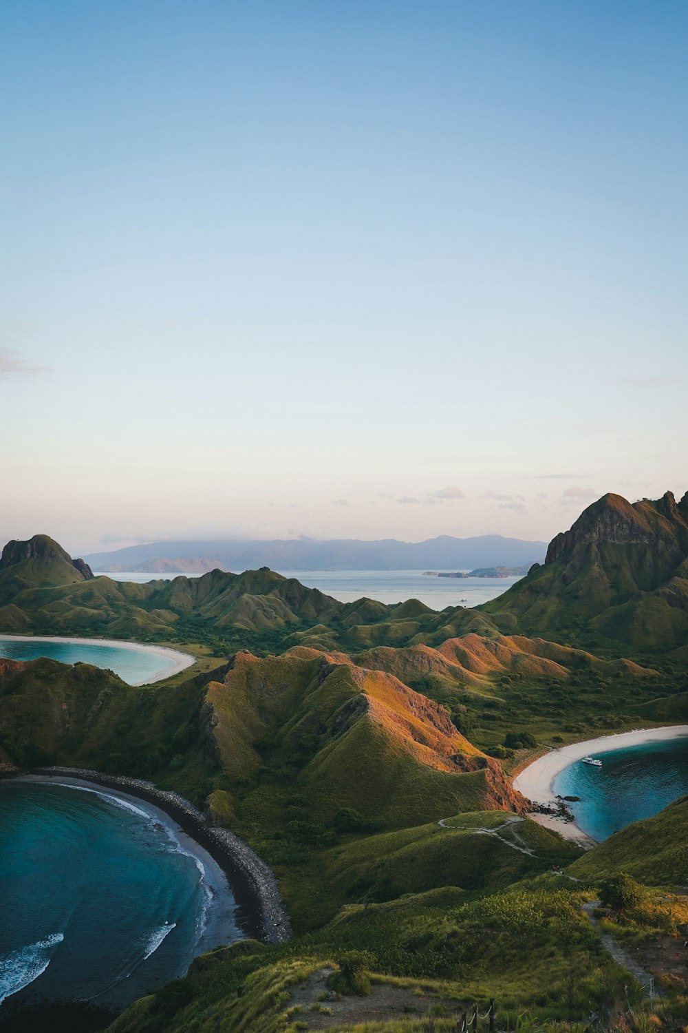 an aerial view of the coastline of a tropical island