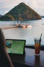 a laptop computer sitting on top of a wooden table