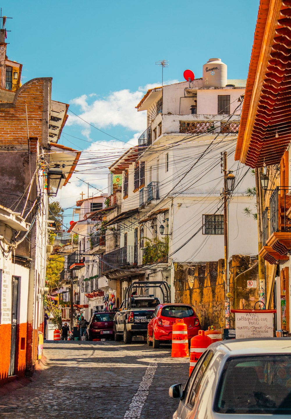 a city street with cars parked on both sides