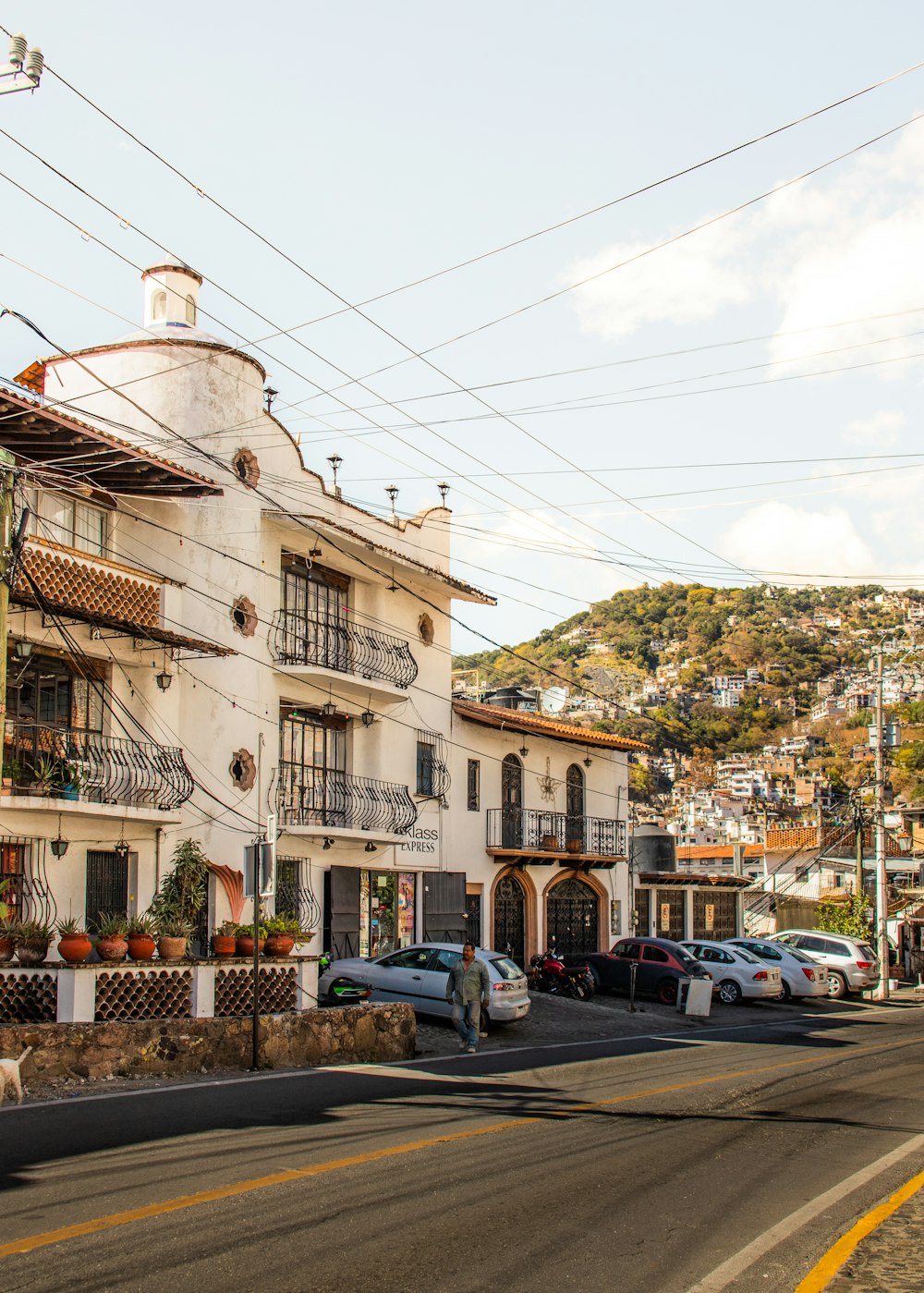 a white building with many balconies on the top of it