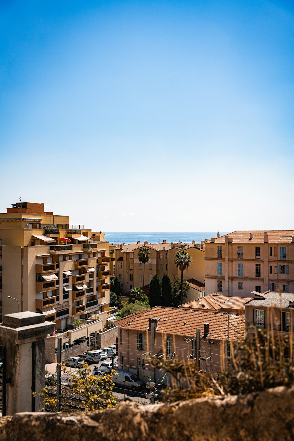 a view of the ocean from a high rise building