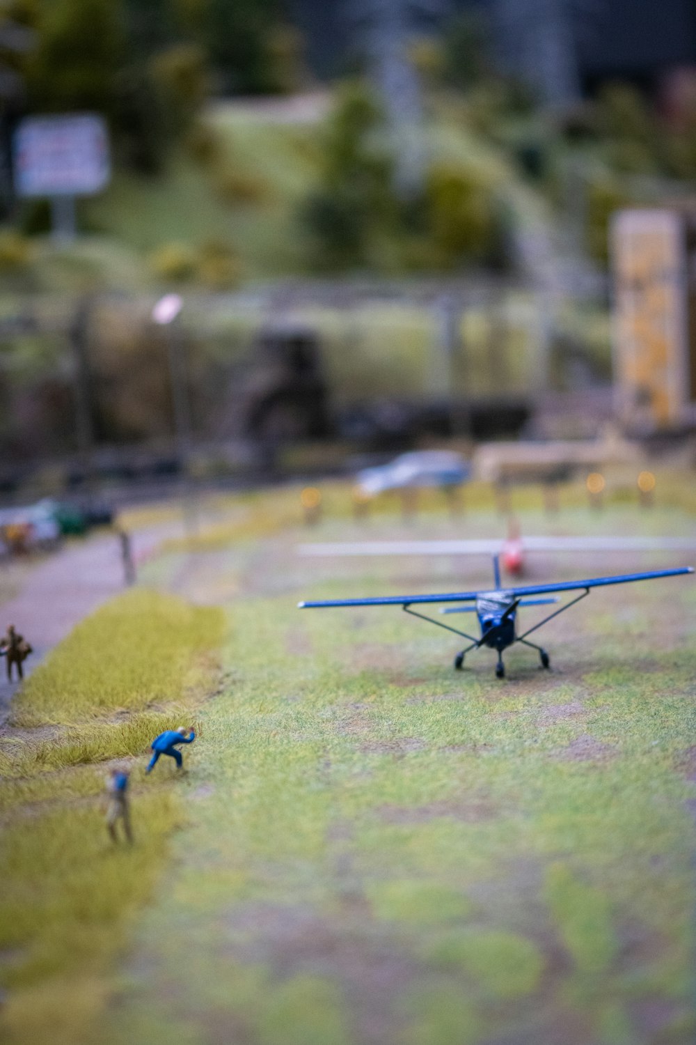 a couple of small toy airplanes sitting on top of a field