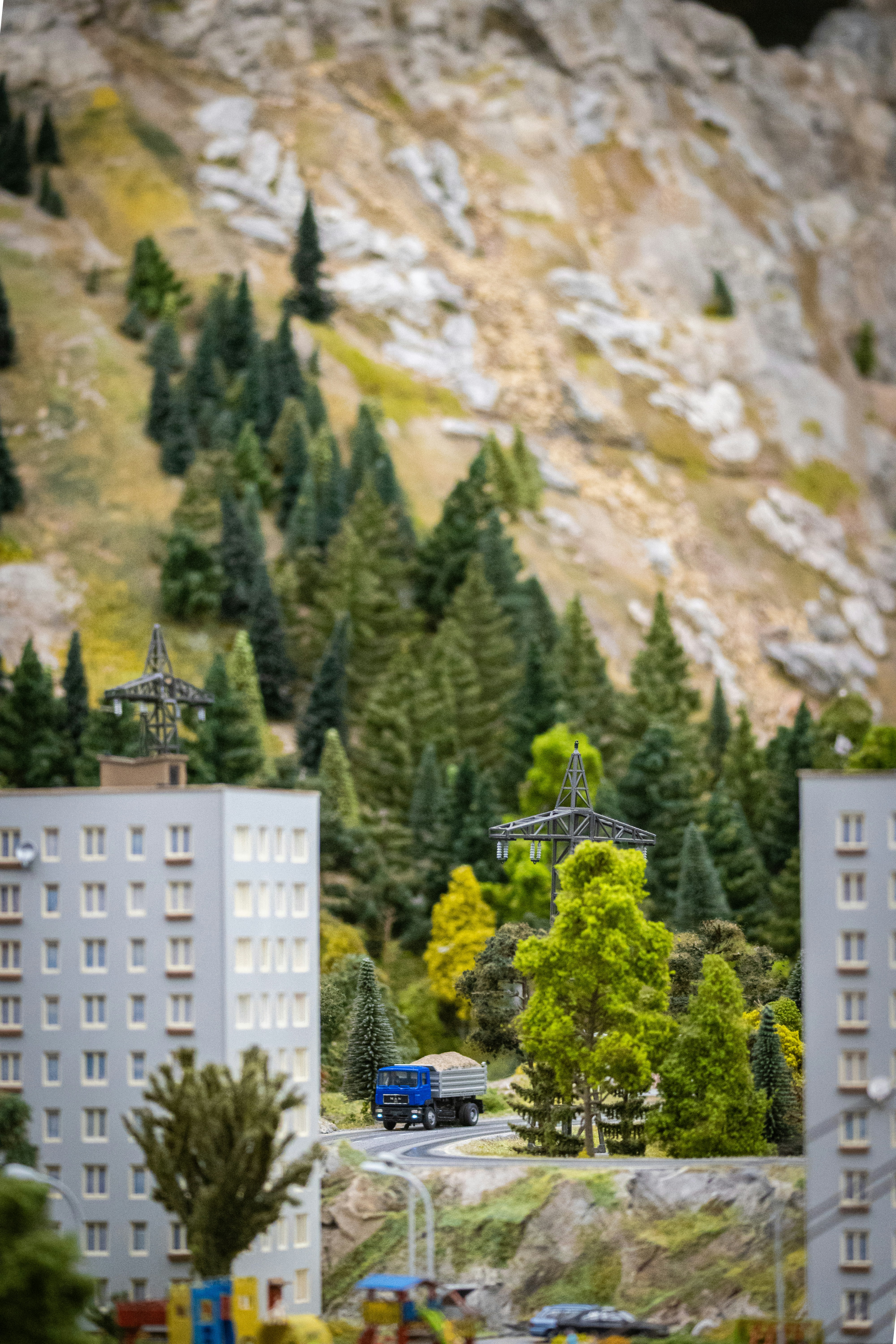A model of a city with a mountain in the background