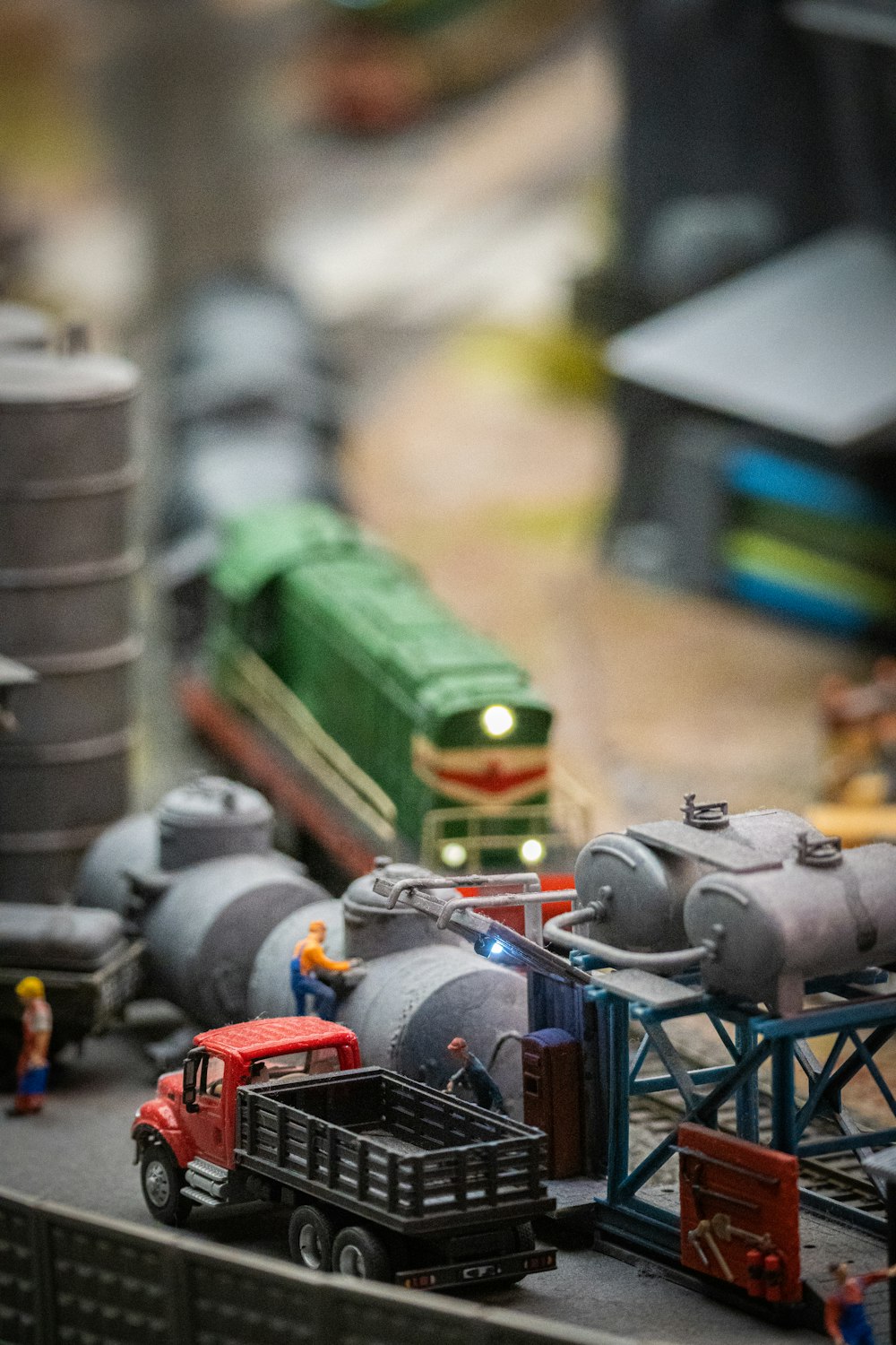 a toy train is on a track with other toys