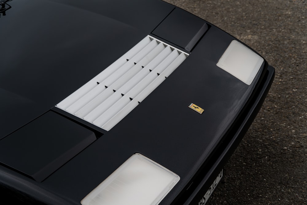 a close up of the hood of a sports car