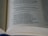 An open book displaying text with varying font styles and sizes, some in bold. The paper appears slightly yellowed, suggesting age or use. The text is printed in a clear serif font with visible indentation and formatting, likely a religious or literary text.