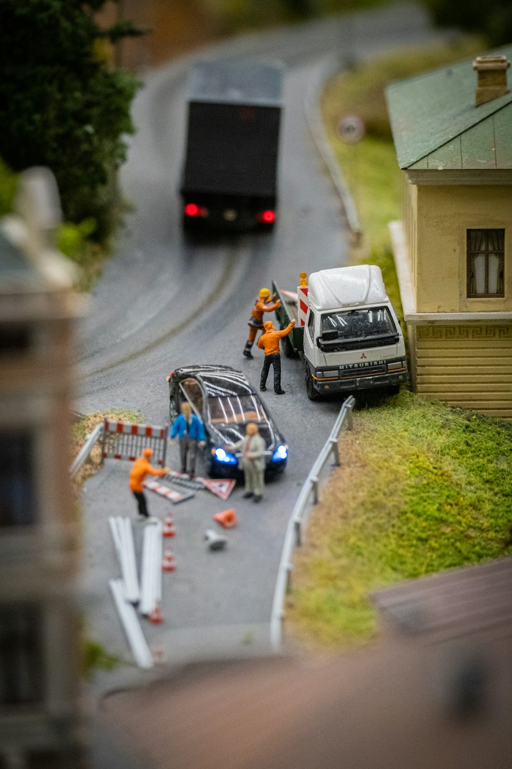 a toy model of a car and a truck on a road