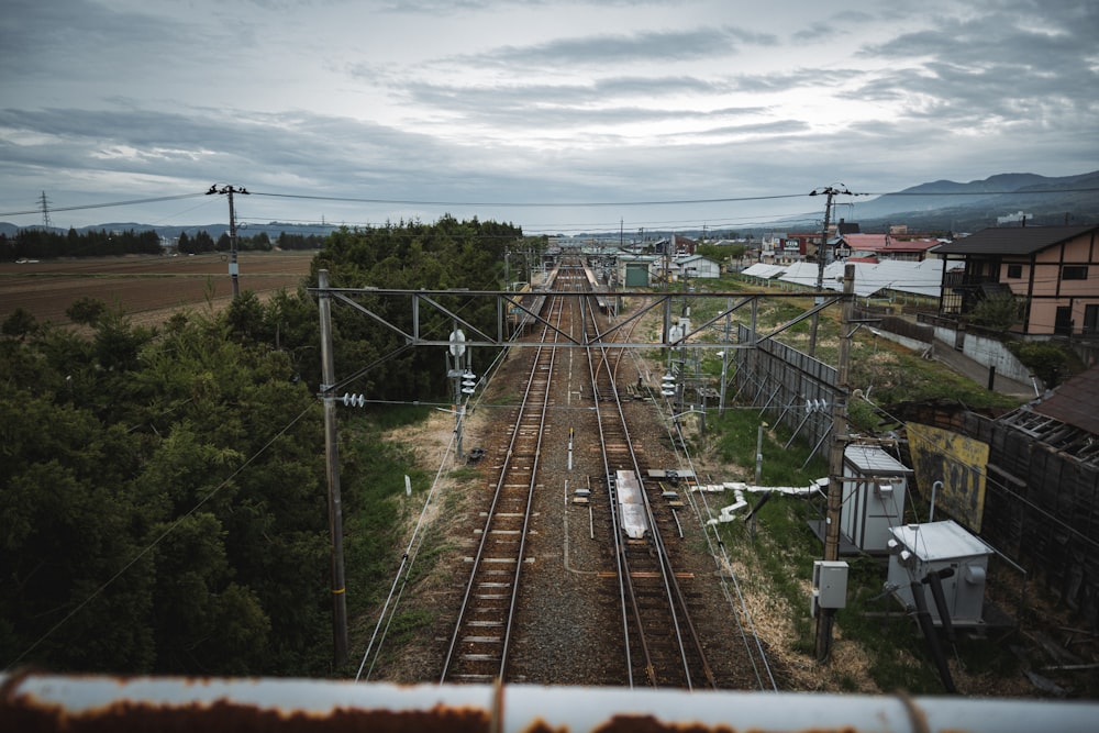 a train track running through a rural countryside