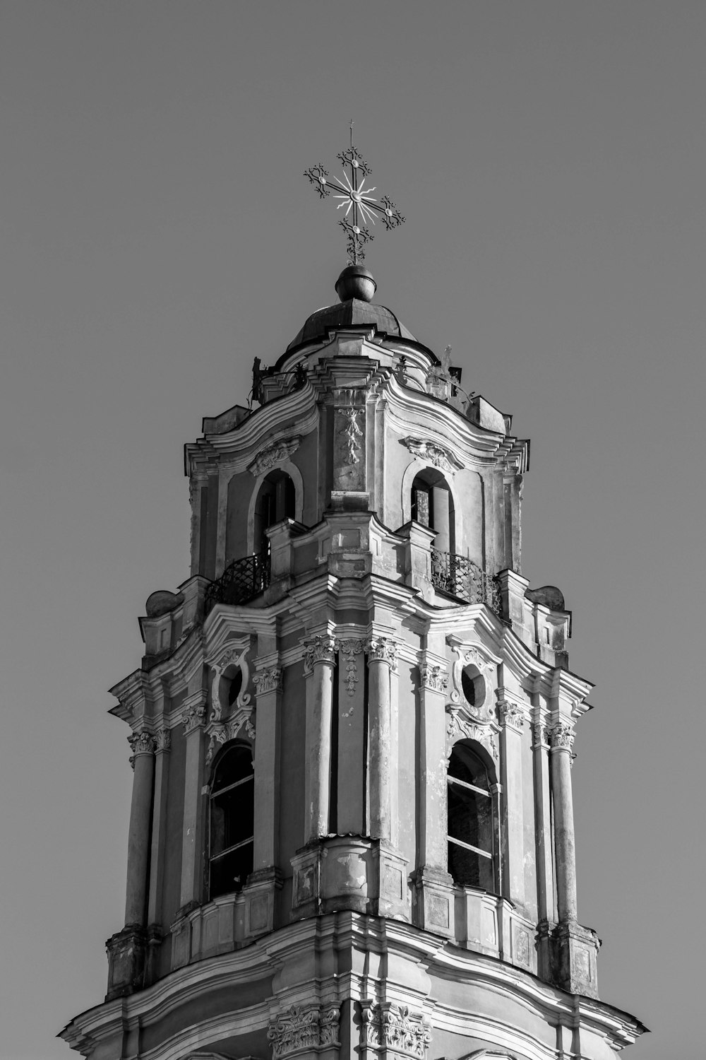 a black and white photo of a clock tower