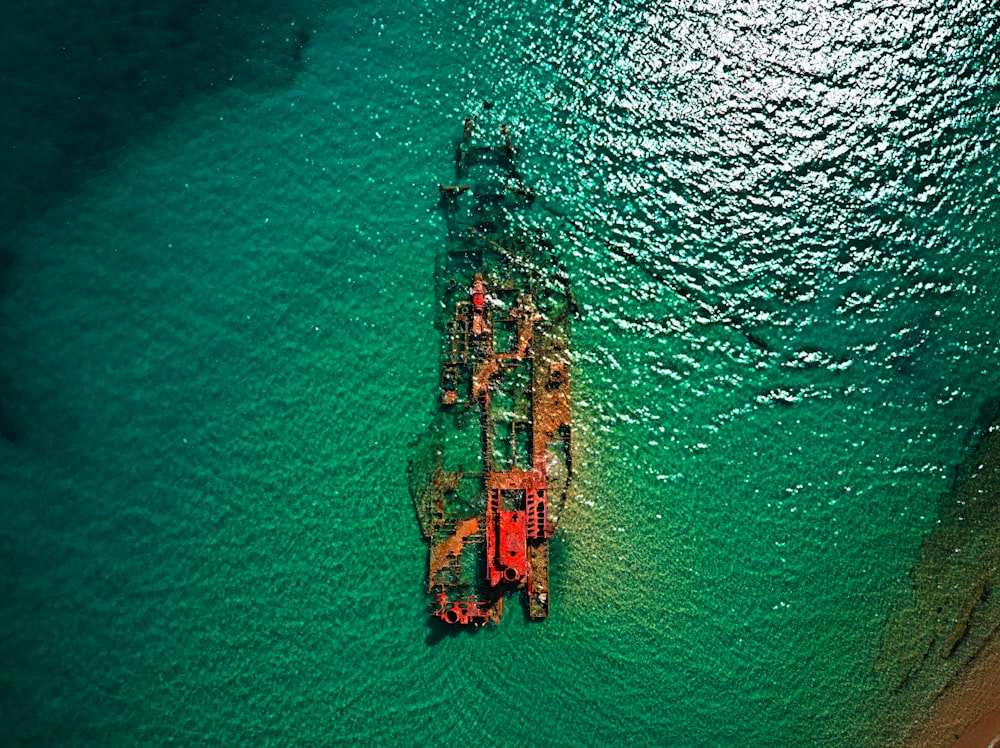 an aerial view of a ship in the water