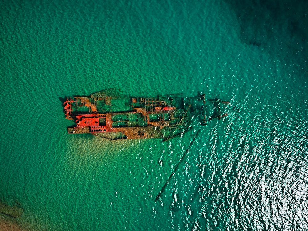 an aerial view of a ship in the ocean