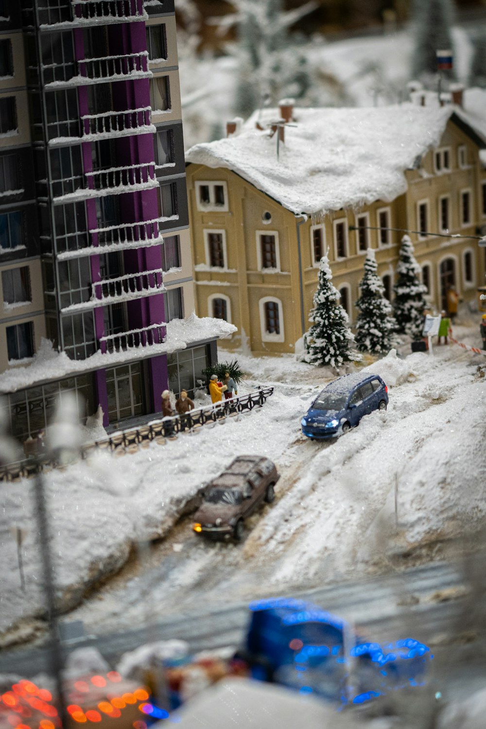 a model of a city with cars and buildings