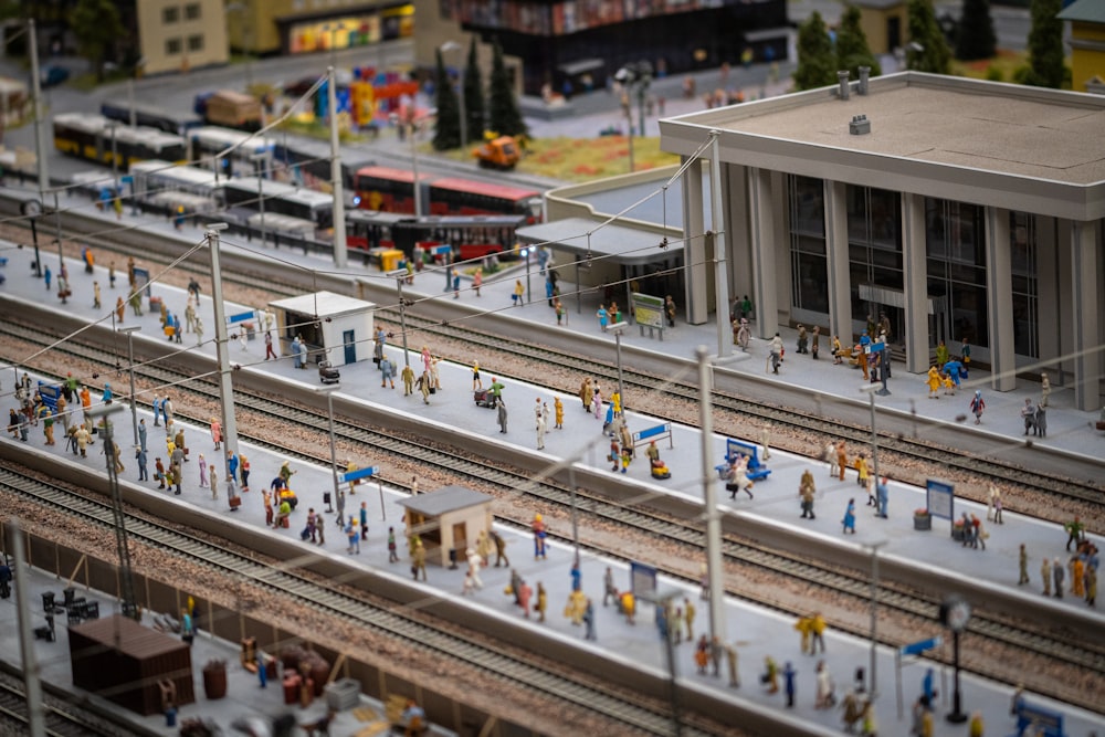 a model of a train station with people on the tracks
