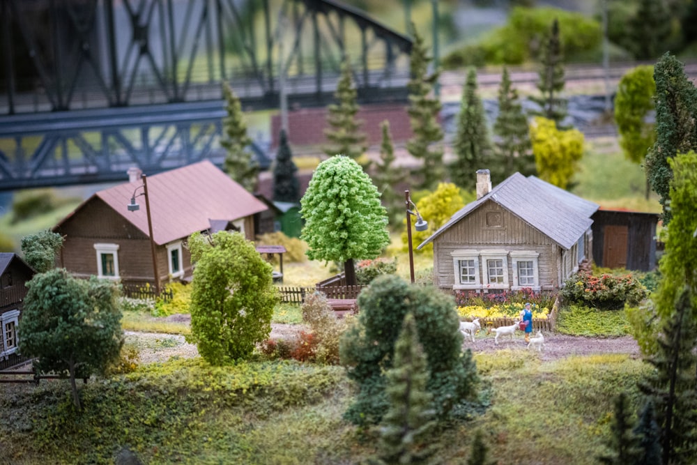 a model of a village with a bridge in the background