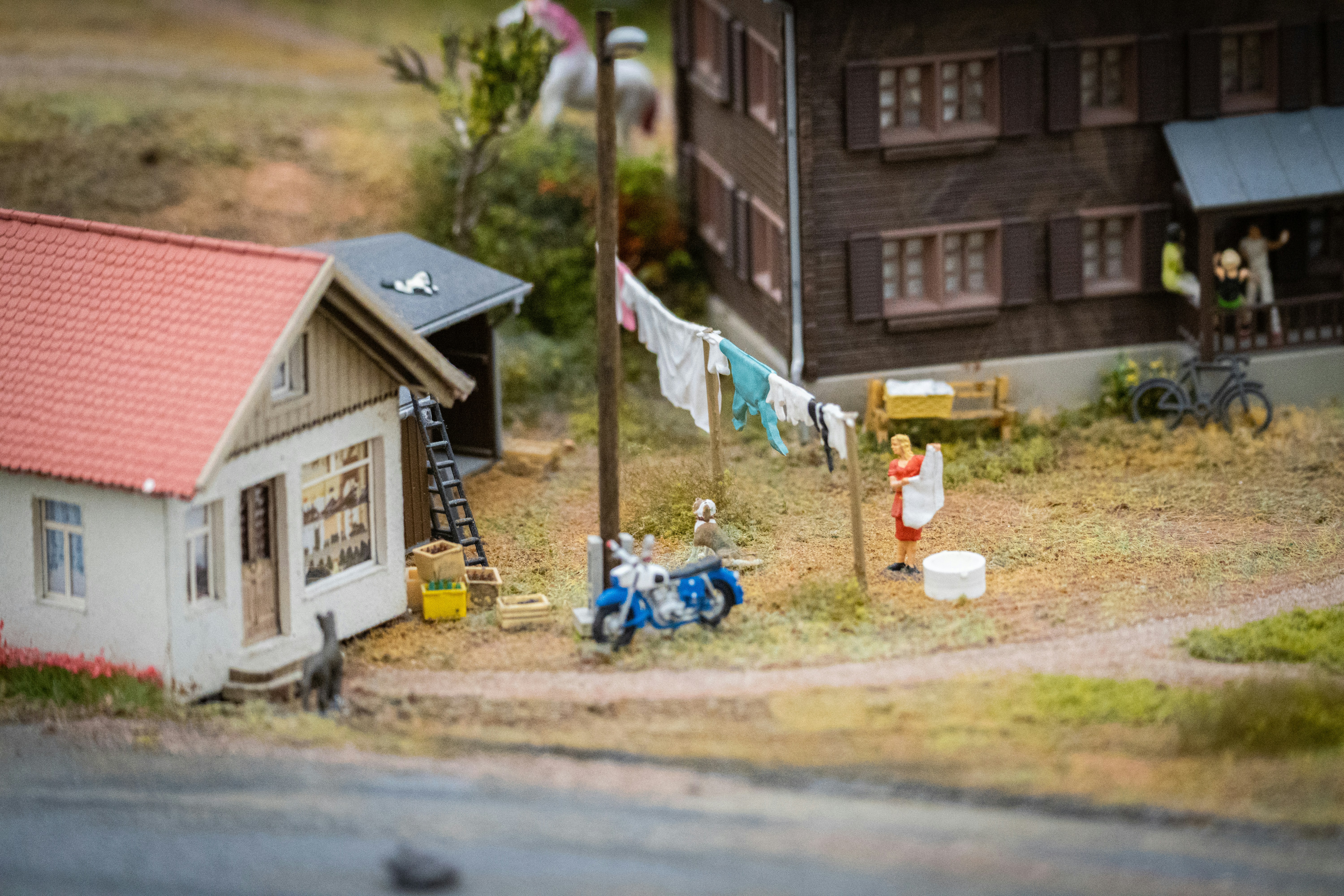 A model of a house with a red roof