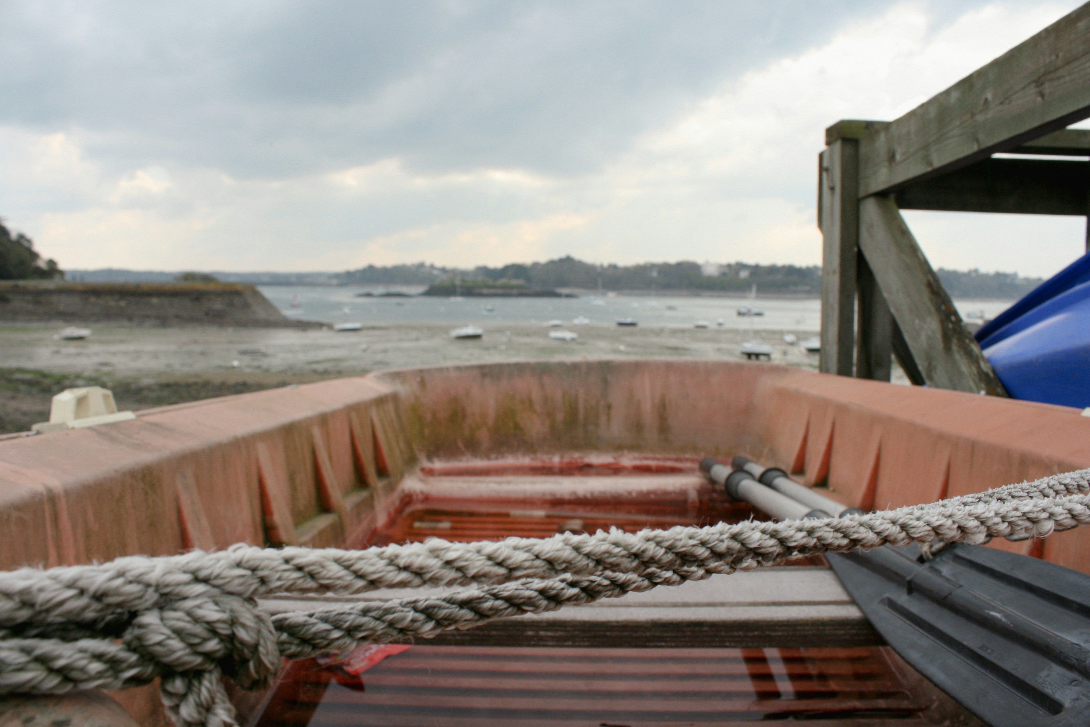 a boat tied up to a wooden dock