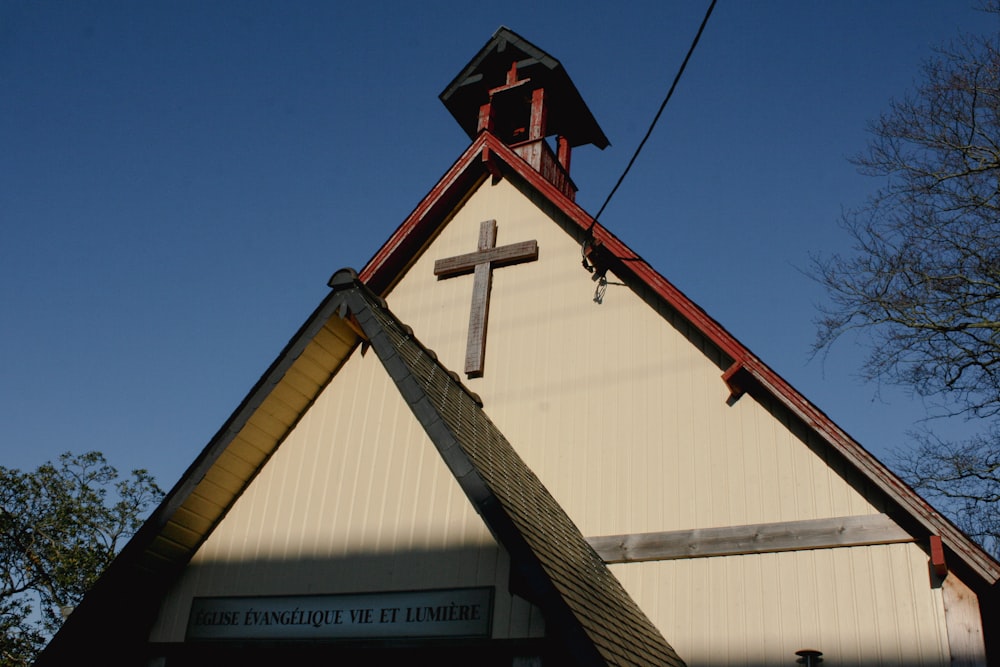 a church with a steeple and a cross on top