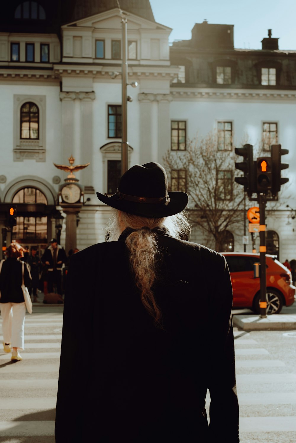 a man with a long beard wearing a hat