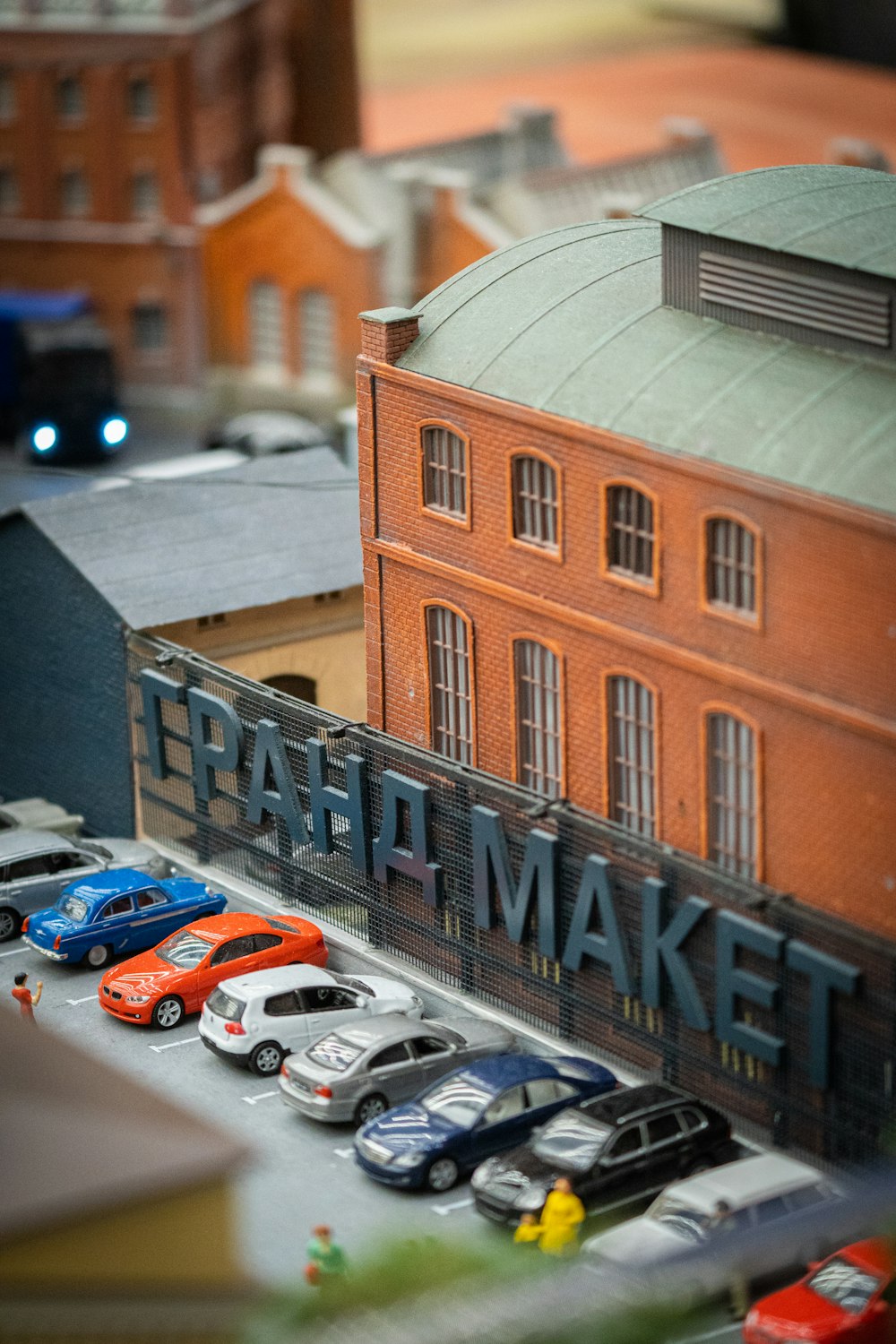 a model of a market with cars parked in front of it