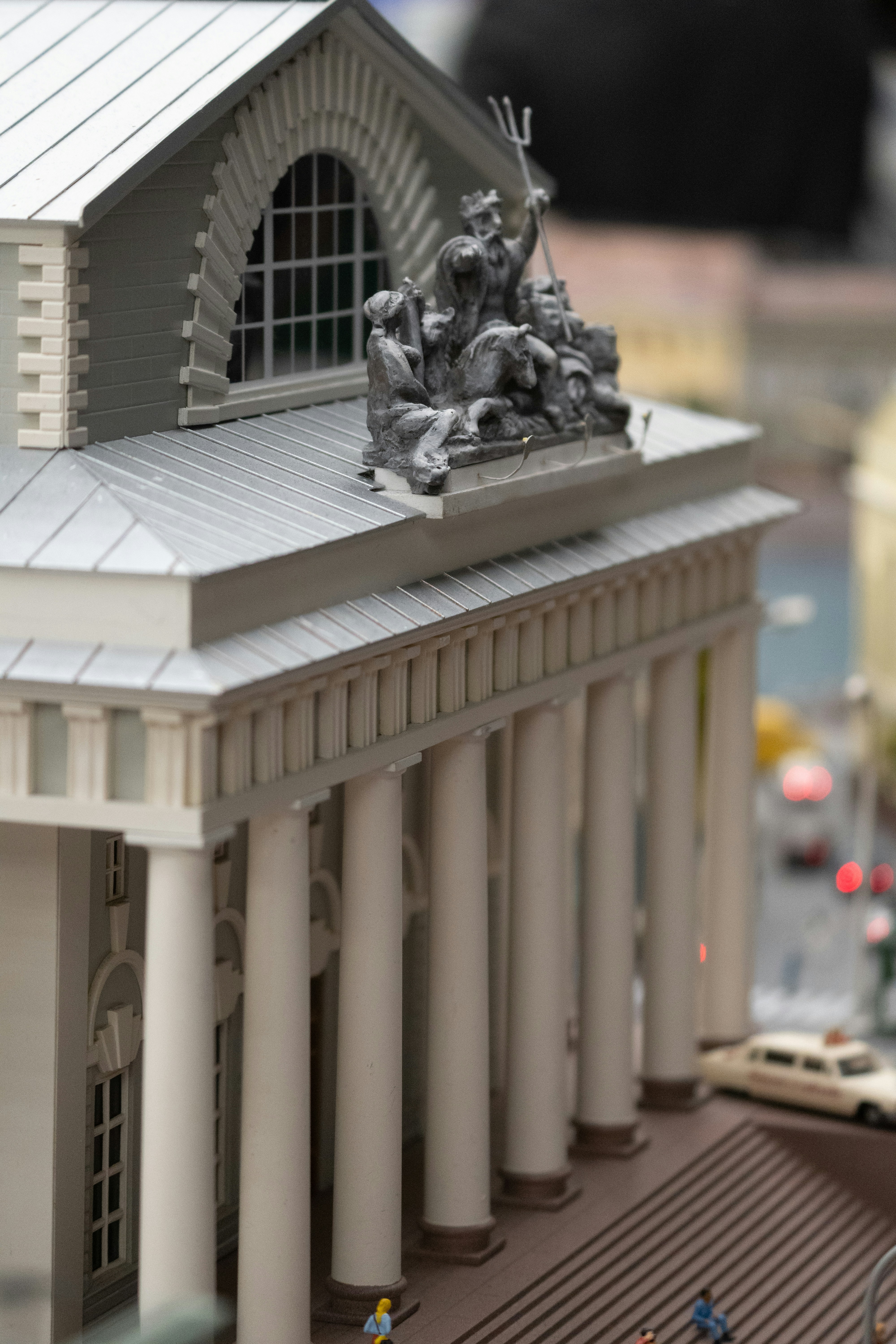 a model of a building with a statue on top of it