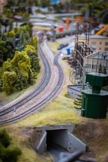A detailed HO-scale model train layout showcasing various scenes.