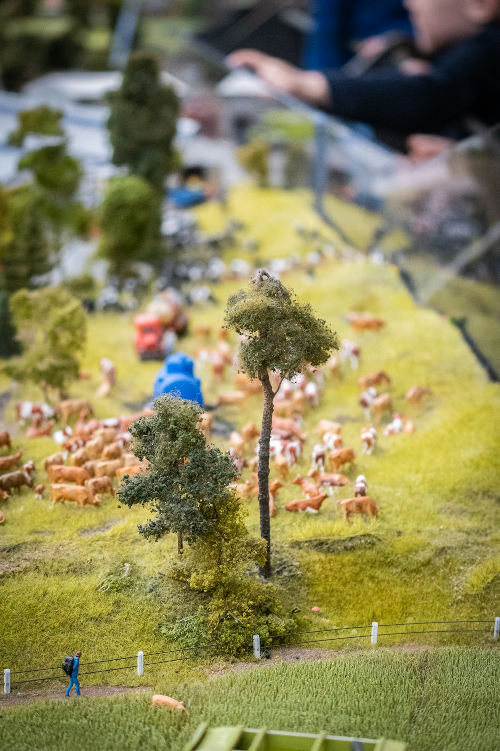 a model of a farm scene with cattle and trees