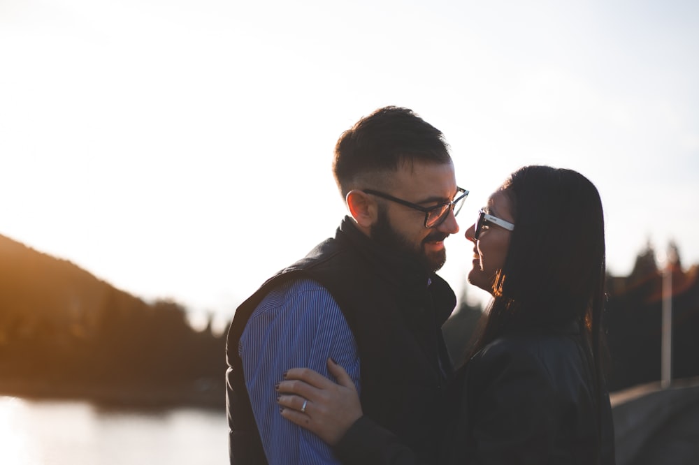 a man and a woman standing next to each other