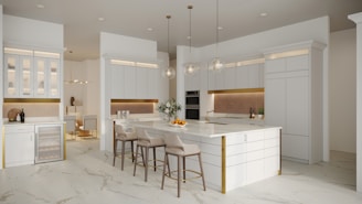a kitchen with a marble counter top and white cabinets