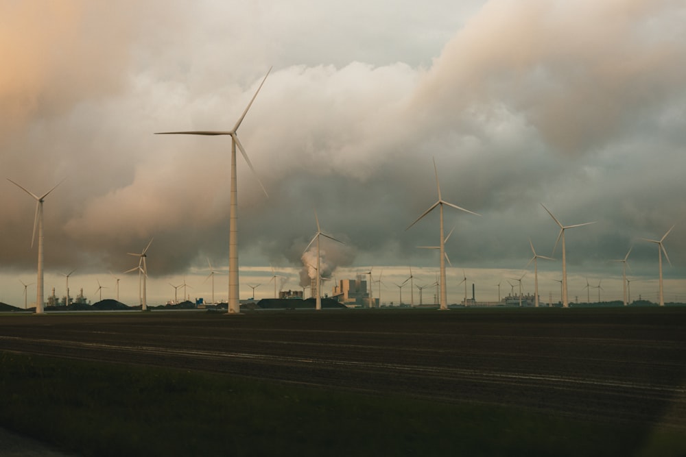 a group of windmills on a cloudy day