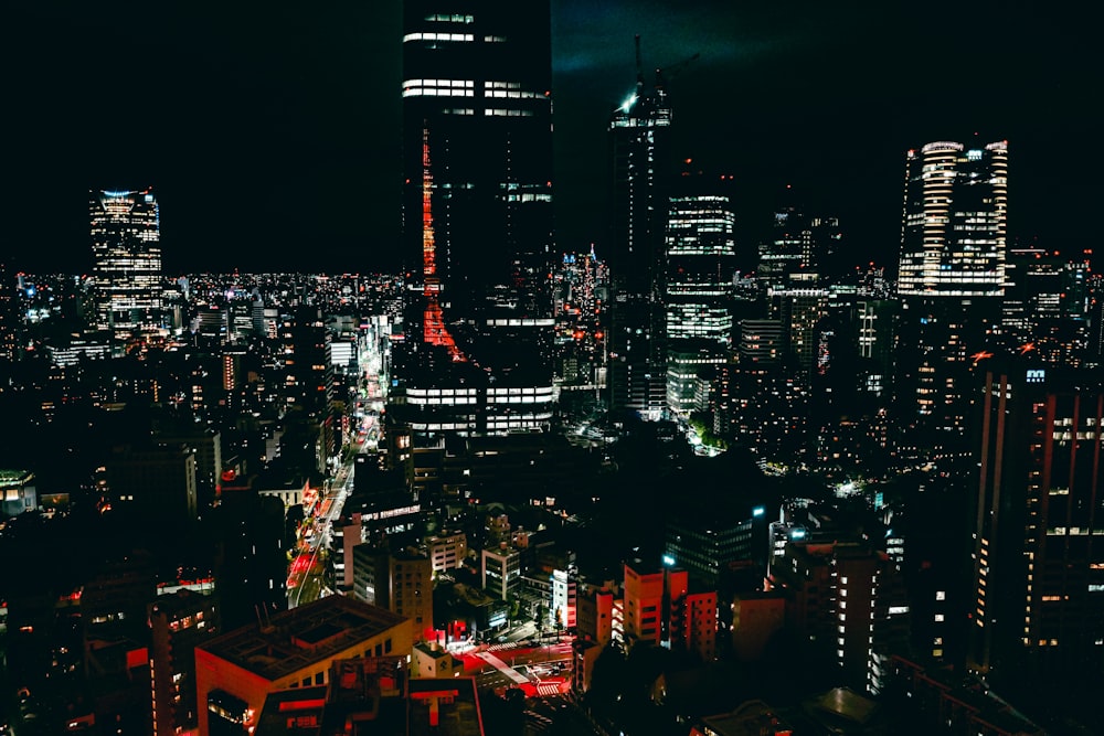 a view of a city at night from the top of a building