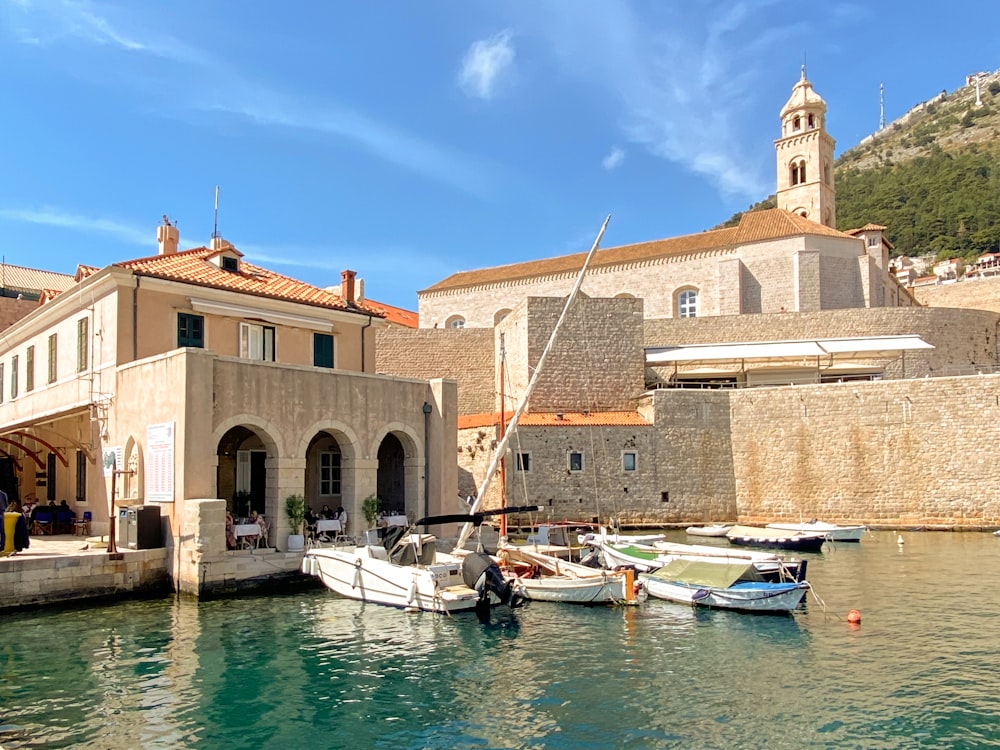 a group of boats that are sitting in the water