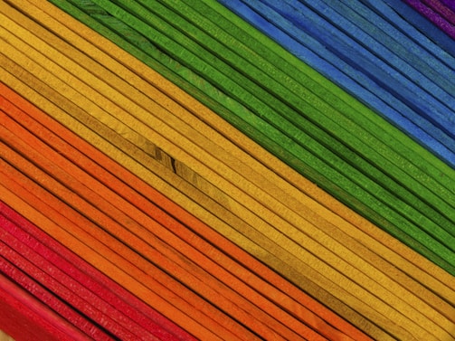 A vibrant display of colorful pickup sticks arranged artistically.