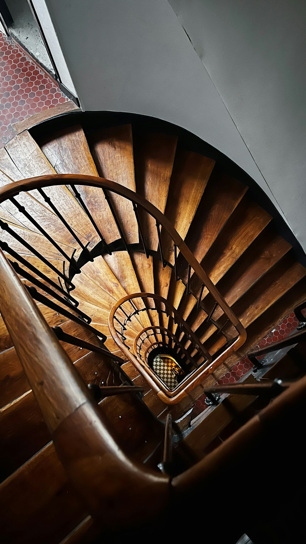 a wooden spiral staircase in a building