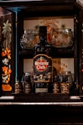 a bottle of alcohol sitting on top of a shelf