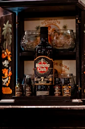 a bottle of alcohol sitting on top of a shelf
