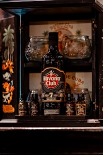 a bottle of alcohol sitting on top of a shelf